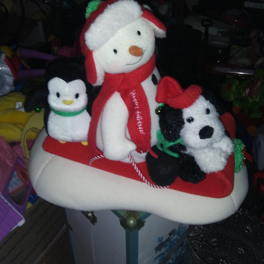 Animated Snowman, dog and penguin on sleigh